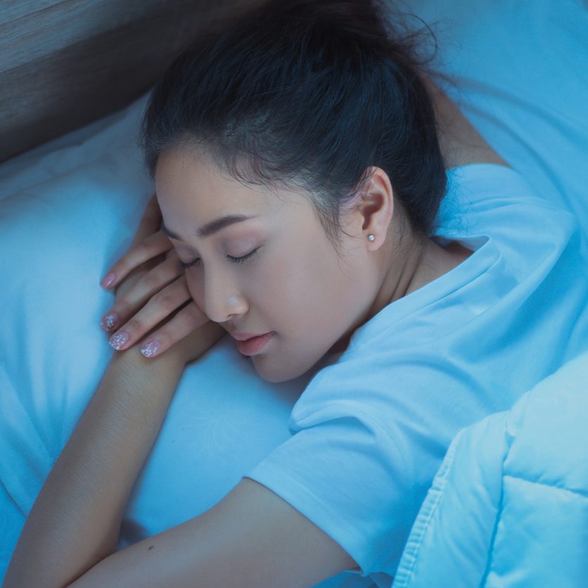 Asian women are sleeping on a top view.
